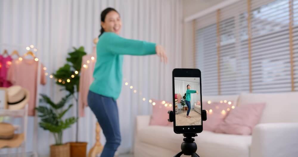 Woman Dancing in front of phone on a tripod 
